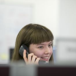 Woman on phone talks to customer