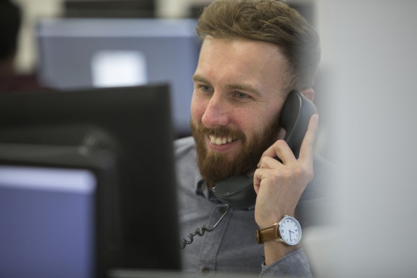 Staff member on phone